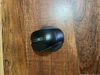 Top view of black Insignia wireless mouse showing buttons and logo