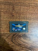 Front of Medabots AX Rokusho Version GBA cartridge