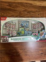 Front of sealed Blooming Waters Premium Collection box showing contents and branding