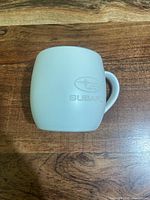 Front view showing Subaru logo and mug shape