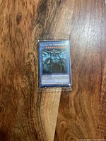 Front view of sealed promo pack showing Obelisk the Tormentor card