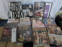 Photo showing front covers of all DVDs with titles including Star Trek, Unstoppable, musicals, and dramas.