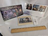 Image showing souvenir sheet and collector envelopes for Sherlock TV series stamps