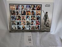 Full page of Royal Mail Star Wars character stamps showing 30 main and secondary characters in color, arranged in grid.