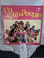 Front cover of vintage Up With People vinyl album showing group photo and logo