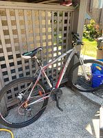 Side view of the Momentum Decline mountain bike showing the full bike and front suspension fork.