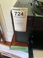 Side view of small wooden table with MaxSold tag and measurements label showing W18 x D13 x H24 inches.