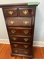 Front view showing seven-drawer tall boy dresser