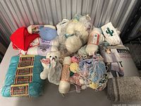Overview of vintage wool lot with yarn skeins, teddy bears and knitting supplies