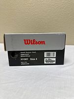 Wilson shoe box showing brand, size, model