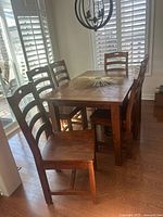 Dining table with six matching reclaimed wood chairs