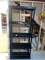 Front view of full shelving unit with five shelves