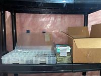 Shelf with organizer box, screw pack and cardboard box