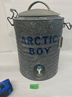 Front view showing Arctic Boy logo, spigot, ribbed galvanized body