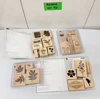 Overview of four clear cases containing wood stamps