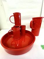 Full set showing pitcher, four mugs and tray