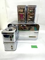 bread box and four chrome canisters full view