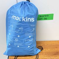 Front view of blue Mockins carry bag containing lounger