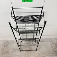 Front angled view showing three mesh tiers and wire frame