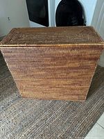 Front view of closed rectangular wicker hamper
