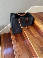 Front and side view of felt tote on stairs
