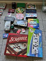 Full layout of mixed board, card and puzzle games on floor