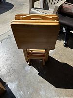 All four folding trays nested in stand