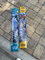 Two packaged stunt kites showing graphics and size labels 60" and 40"