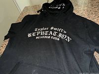 Front view showing graphic text and kangaroo pocket