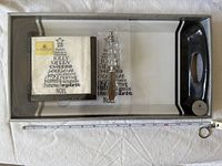 Full boxed set showing tray, napkins, spreader with measuring tape