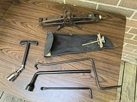 Entire lot: scissor jack, pouch, T-handle wrench, jack handles, rods