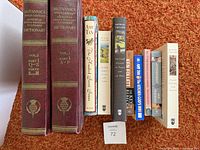 Front view of all 11 books showing spines and titles