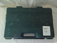 Closed dark green Hitachi carry case
