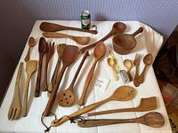 Overall view of all carved utensils on table