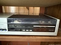 Front and top of AIWA linear tracking turntable on shelf