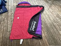 Eureka red rectangular sleeping bag laid flat showing logo