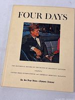 Front cover of the book titled 'Four Days' showing President John F. Kennedy in a car.