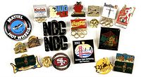 Overview of entire pin collection featuring various collectible and Olympic themed pins.