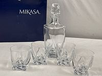 Full set of Mikasa crystal: decanter, stopper, and four glasses displayed with original box.