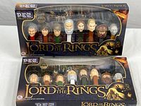 Two original sealed Pez Lord of the Rings Dispenser collector sets with 8 characters each visible through window.