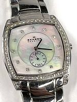 Close-up of the Skagen watch face showing the iridescent mother-of-pearl dial, rhinestone hour markers and bezel rhinestones