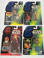 Four sealed Star Wars action figures in packaging showing front views of cards and figures including Leia Organa, Yoda, Ewoks Wicket & Logray, and Mace Windu.