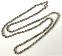 Full length view of the sterling silver rope chain necklace showing the clasp and chain design.