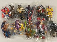 All 11 figures and accessories individually bagged together