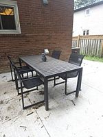 full view of patio dining set: table and four chairs