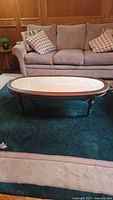 Full view of mahogany coffee table in living room setting