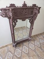 Full view of ornate wooden mirror front