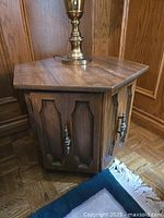 Full view of hexagonal side table showing doors and finish