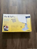 Box of Carex Day-light Sky therapy lamp showing brand, product name, features and image of the lamp.