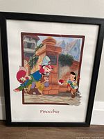 Framed Pinocchio print front view showing the image in black frame.
